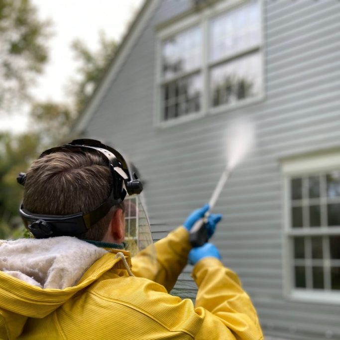 Power washing a residential house